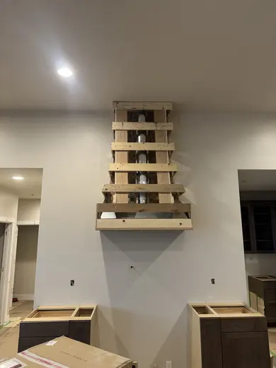 Range hood framing and the later shaped hood enclosure, view 1.
