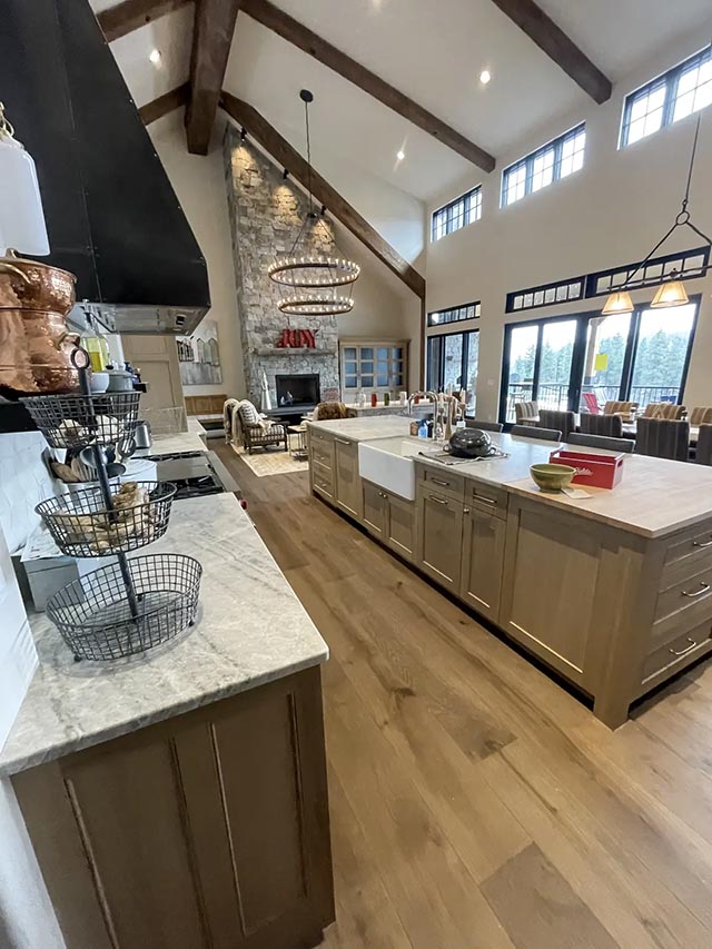 Titus Rd kitchen with installed cabinetry, island and exposed ceiling beams